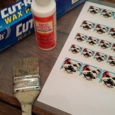 Supplies for sealing your paper art with ModPodge before applying ice resin.